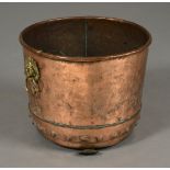 A 19TH CENTURY RIVETED COPPER LOG BIN, with lion mask ring handles, on paw feet,