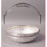 A SECESSIONIST STYLE SILVER PLATED BASKET, the fixed handle pierced and cast with panel of fruit,