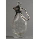 AN ART NOUVEAU SILVER PLATE MOUNTED CRYSTAL GLASS EWER, having a twig finial to the domed cover,