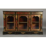 A 19TH CENTURY BOULLE AND EBONISED BREAKFRONT SIDE CABINET with cut brass and tortoiseshell scroll