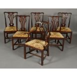 FIVE GEORGE III MAHOGANY DINING CHAIRS in Chippendale style,