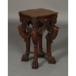 A 19TH CENTURY MAHOGANY URN STAND, of square serpentine outline, the later top with moulded rim,