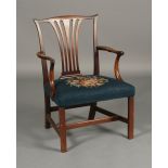 A GEORGE III MAHOGANY ELBOW CHAIR OF HEPPLEWHITE DESIGN,