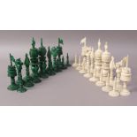 A LATE 19TH CENTURY INDIAN CARVED IVORY CHESS SET, one side stained green,