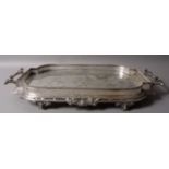 A VICTORIAN SILVER PLATED GALLERIED TRAY IN AESTHETIC TASTE, of shaped oblong form,