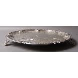 A VICTORIAN LARGE ELECTROPLATE SHAPED CIRCULAR SALVER engraved with formal shell and foliate