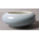 A CHINESE PORCELAIN SHALLOW BOWL with everted rim, pale blue graduated glaze,