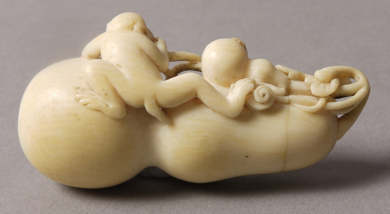A 19TH CENTURY CHINESE IVORY DOUBLE GOURD BOTTLE, carved with a monkey, vine and gourd, - Image 2 of 2