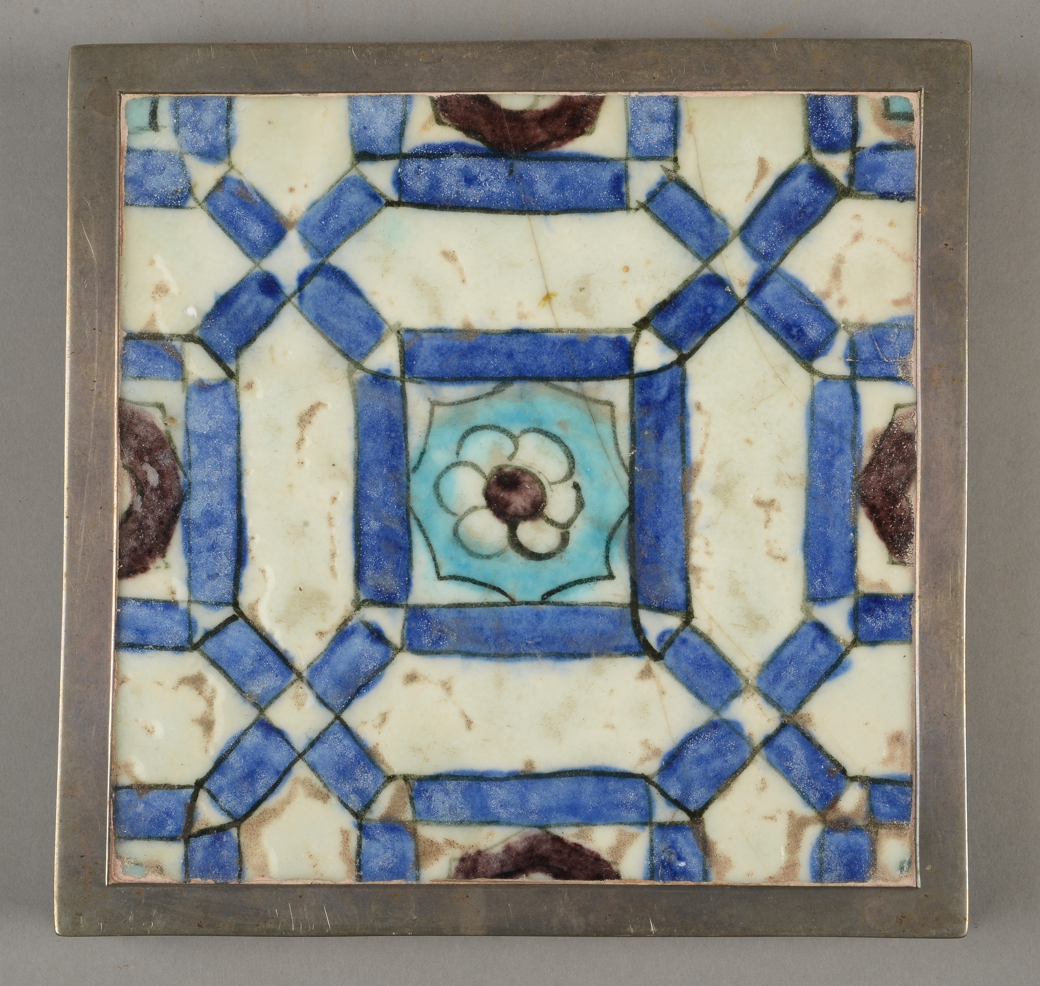 AN ISLAMIC GLAZED FLOOR TILE, probably 16th century,