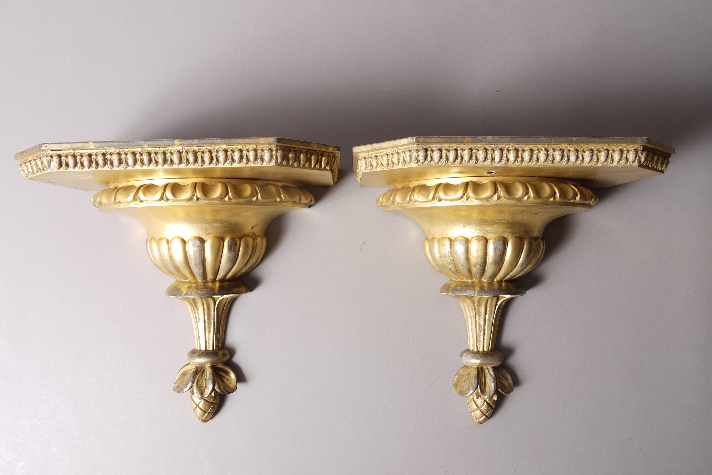 A PAIR OF GILTWOOD WALL BRACKETS, 20th century, each of canted rectangular form,