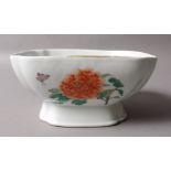 A CHINESE SQUARE FORM FOOTED BOWL decorated in famille rose colours with butterflies and orange