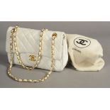 A VINTAGE CHANEL MAXI FLAP BAG, quilted white lambskin,