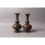 A PAIR OF 19TH CENTURY CONTINENTAL MARBLE URNS of bloodstone colouring,