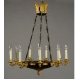 AN EMPIRE STYLE NINE BRANCH CHANDELIER, with gilt scroll arms from a circular dish,