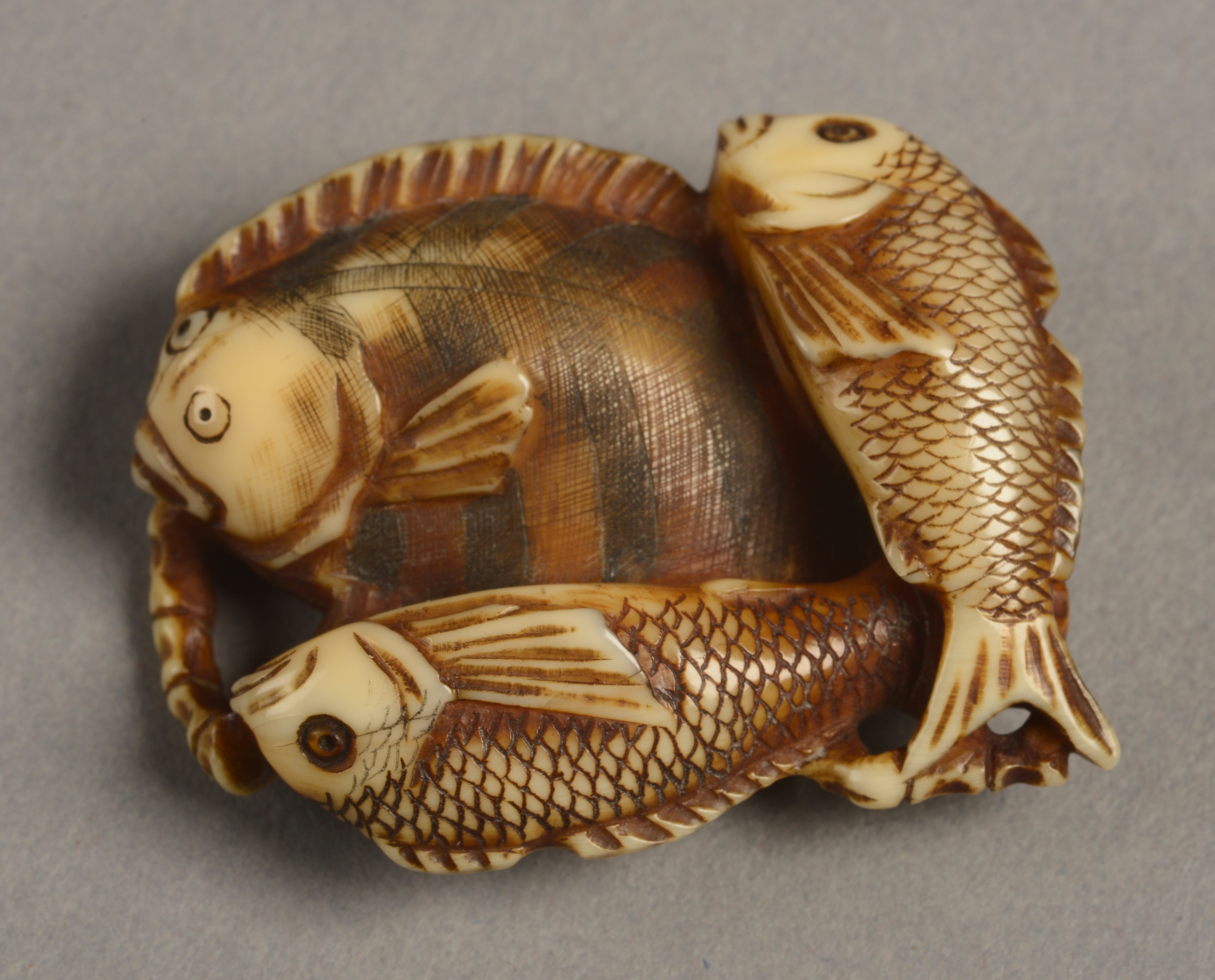 A JAPANESE IVORY NETSUKE, Meiji period,