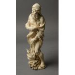 A EUROPEAN CARVED IVORY FIGURE OF WINTER, probably German late 17th/early 18th century,