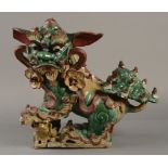 A CHINESE EARTHENWARE RIDGE TILE FINIAL IN TANG STYLE,