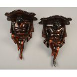 A PAIR OF LATE 19TH CENTURY VENETIAN STYLE CARVED AND STAINED SOFTWOOD WALL BRACKETS,