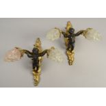 A PAIR OF FRENCH GILT BRONZE DOUBLE BRANCH WALL LIGHTS of rococco scroll form,