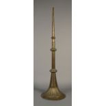 AN INDIAN BRASS KARNAI, 19th century, with triple knopped stem and fluted bell,