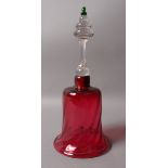 A VICTORIAN CRANBERRY GLASS BELL with clear glass handle with green knopped finial,