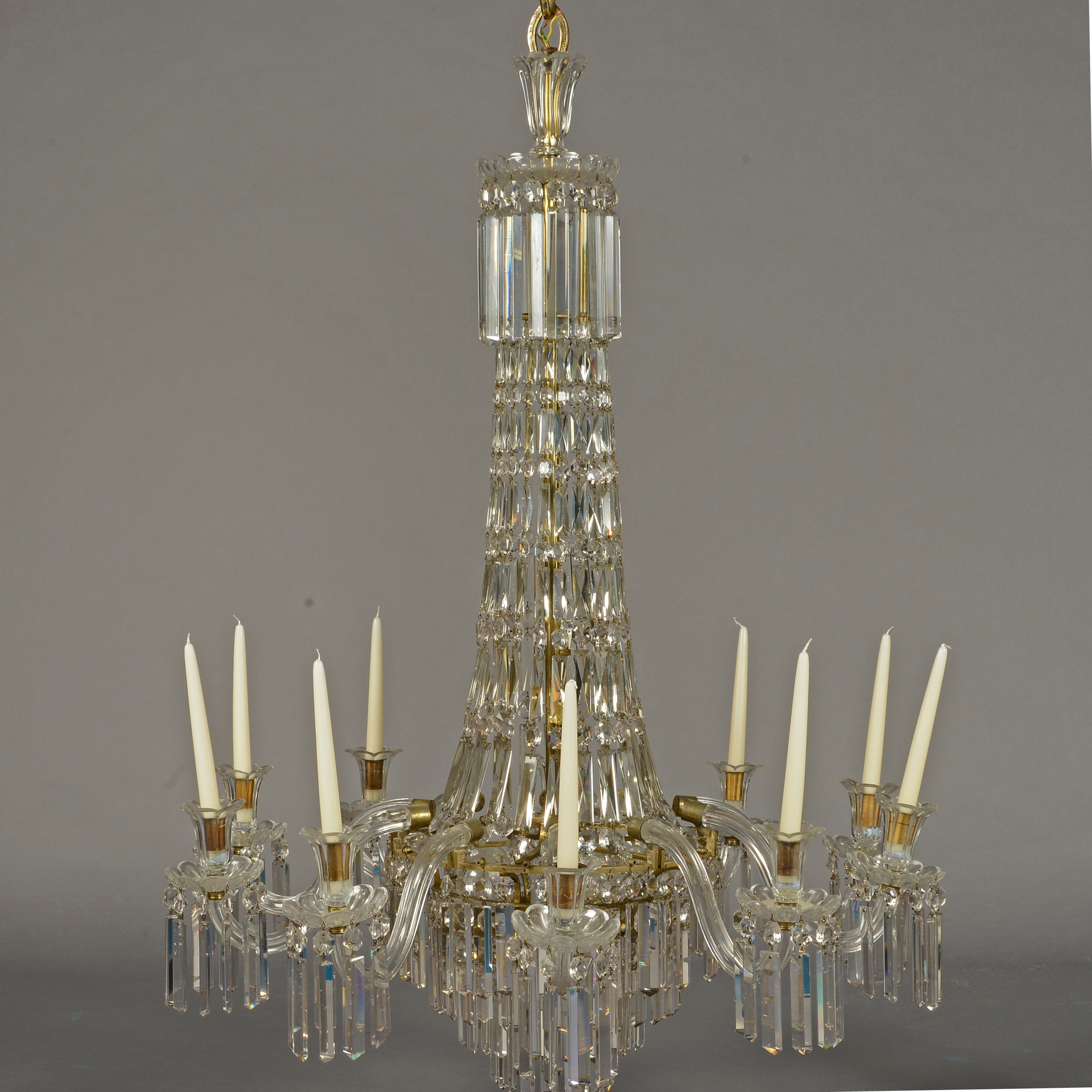 A CUT GLASS CHANDELIER, ten lights of swept basket form with ten out-curved arms,