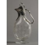 AN ART NOUVEAU SILVER PLATE MOUNTED CRYSTAL GLASS EWER, having a twig finial to the domed cover,