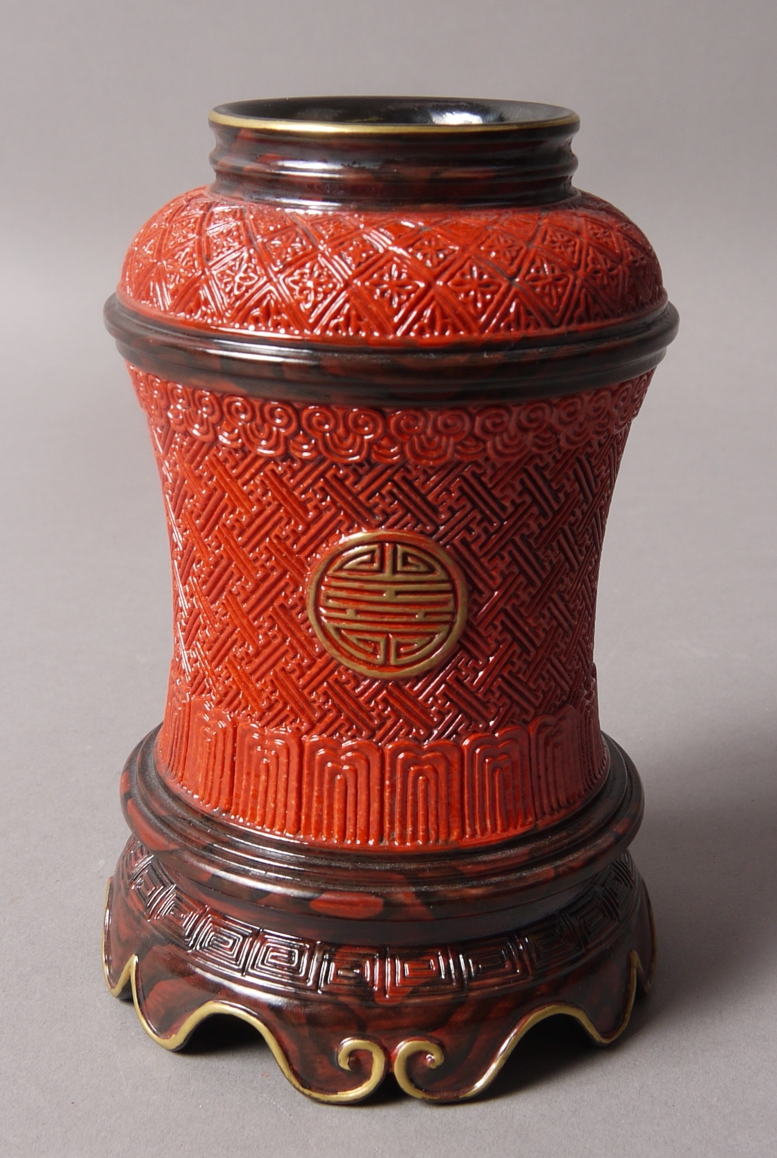 A CHINESE RED GROUND WAISTED VASE,