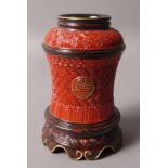 A CHINESE RED GROUND WAISTED VASE,