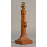 A ROBERT THOMPSON OF KILBURN 'MOUSEMAN' light oak table lamp of octagonal tapering section with