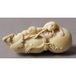 A 19TH CENTURY CHINESE IVORY DOUBLE GOURD BOTTLE, carved with a monkey, vine and gourd,