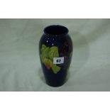 A Circular Based Blue Ground Moorcroft Pottery Floral Decorated Baluster Vase, Signed, 8" High