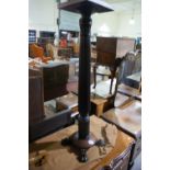 An Acanthus Column Torchere Stand On Four Claw Feet