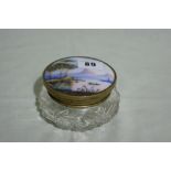 A Circular Cut Glass Dressing Table Jar With Porcelain Lid Decorated With Landscape View