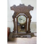 An Edwardian Period "Ginger Bread" Pendulum Clock