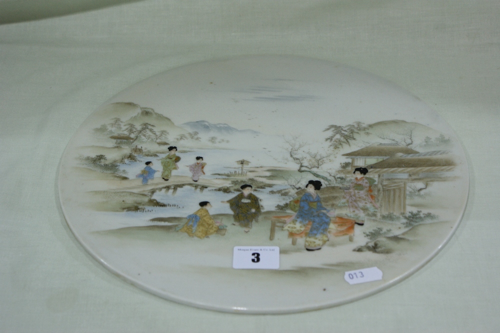 A Circular Japanese Satsuma Plaque With Figure And Landscape Scene