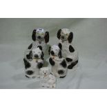 Five Staffordshire Pottery Seated Dogs