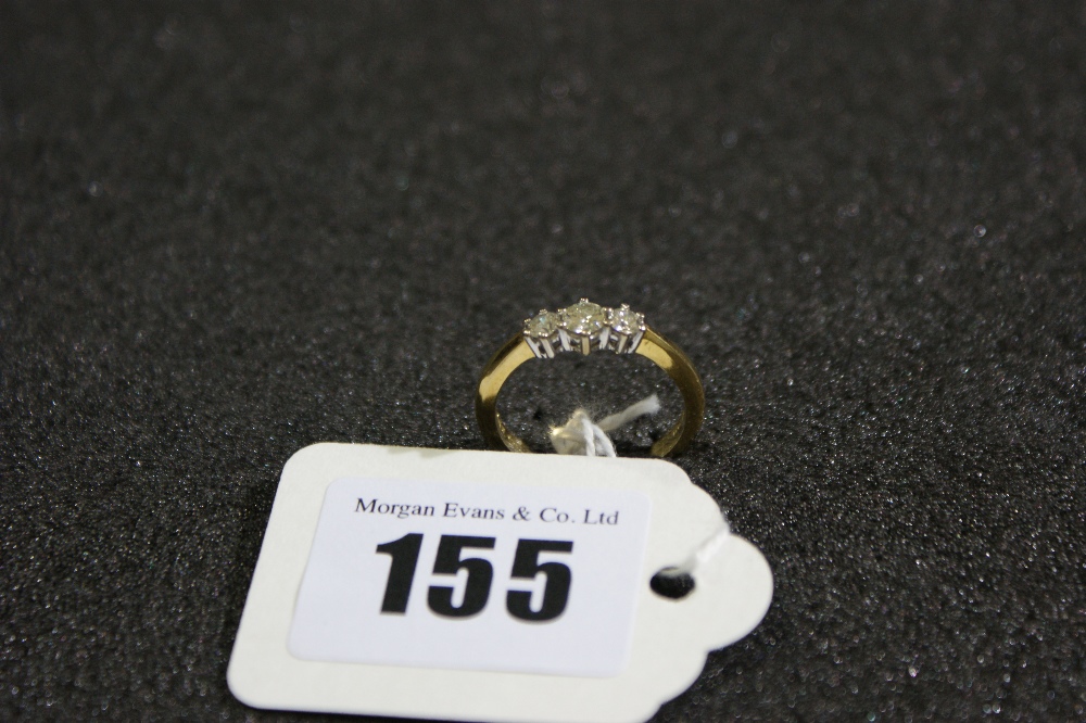 An 18 Carat Gold Three Stone Diamond Ring, Approx .50 Carat