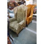 A Pair Of Early 20th Century Winged Backed Arm Chairs
