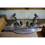 A Pair Of Cast Metal Foliat Form Fire Dogs And Iron Together With An Oval Two Handled Drinks Tray