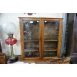 An Early 20th Century Walnut Two Door Collector's Cabinet