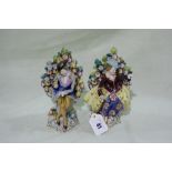 A Pair Of 19th Century Continental Porcelain Figures In The Meissen Style, Each Seated Against A