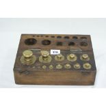 An Eleven Piece Part Set Of Brass Laboratory Scale Weights With In An Oak Box