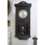 An Oak Encased Pendulum Wall Clock