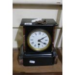 A Victorian Black Marble Encased Mantle Clock With White Circular Dial