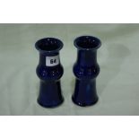 A Pair Of Royal Doulton Circular Based Blue Ground Stoneware Vases