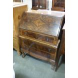 A Mid 20th Century Walnut Veneered Three Drawer Bureau