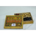 A Box Of Colour Stained Wooden Games Pieces Or Pawns