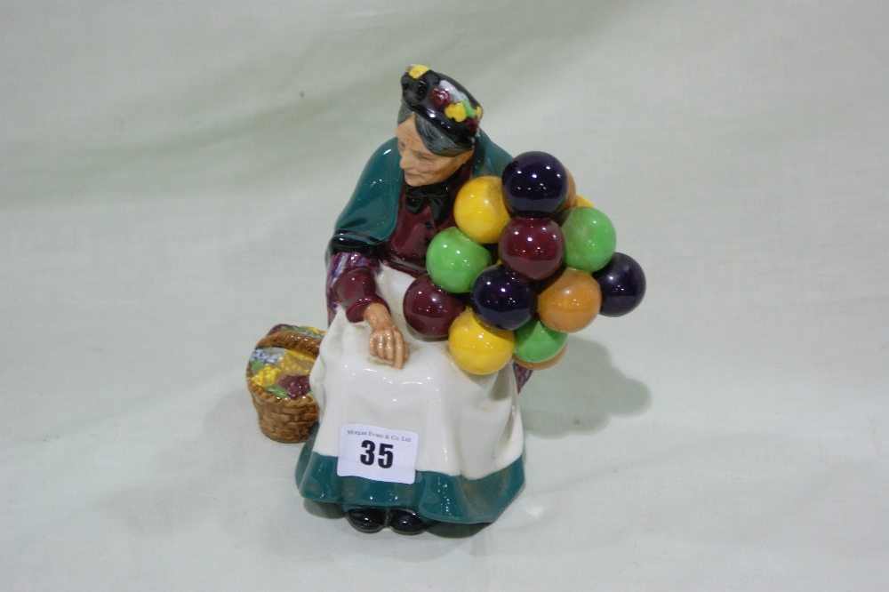 A Royal Doulton China Figure "The Old Balloon Seller" HN1315