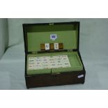 A Mid 20th Century Bone And Bamboo Backed Mahjong Set Within A Wooden Case